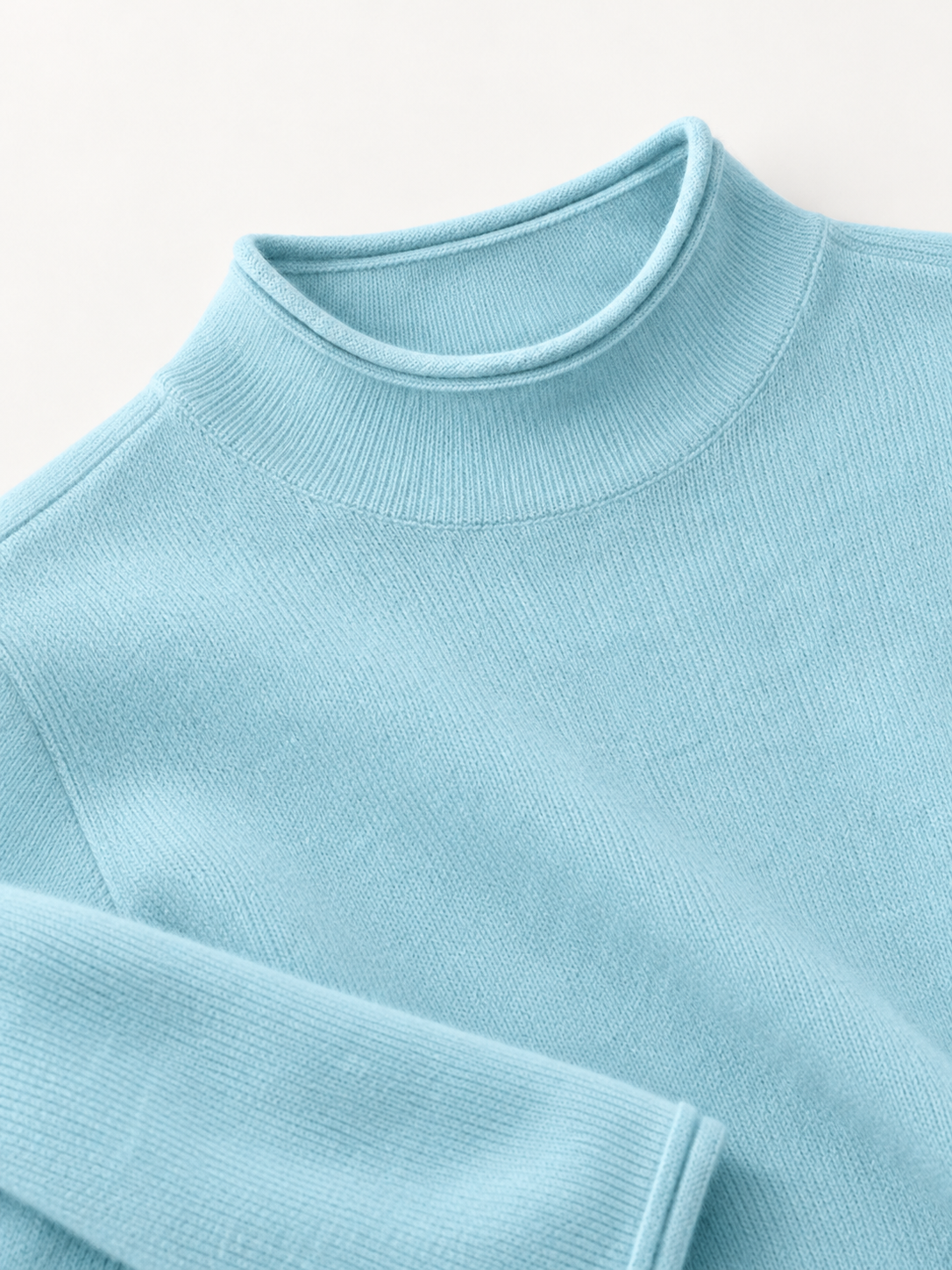Roll-Edge Mock-Neck Sweater in Lake Blue — knit detail