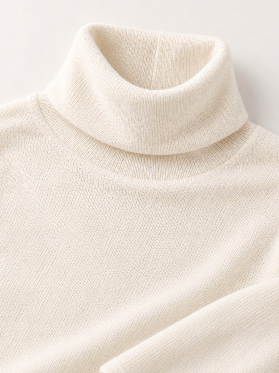 Roll-Edge Turtleneck Sweater in White — knit detail