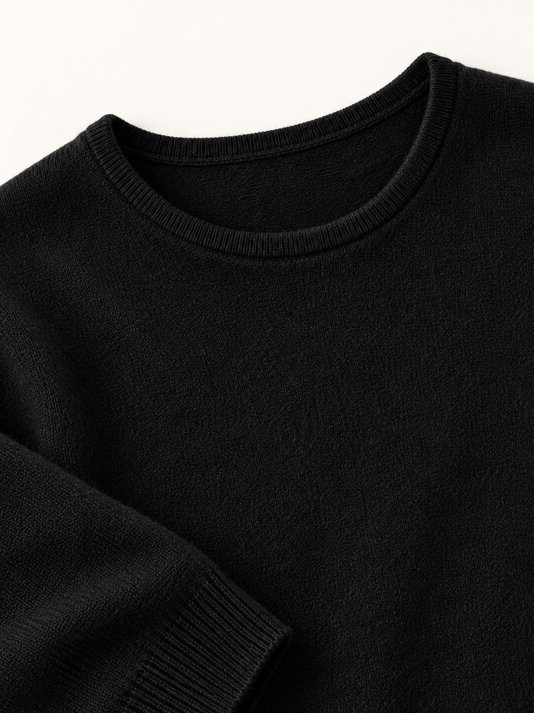 Roll-Edge Crewneck Knit Sweater in Black — knit detail